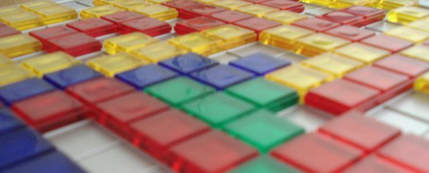 Blokus Yet another easy, quick and very clever game: your only goal in Blokus is to place all your tiles on the board, and the only restriction is that they must touch your other tiles, but only by a corner. Oh, and three other people are trying to do the same and get in your way.